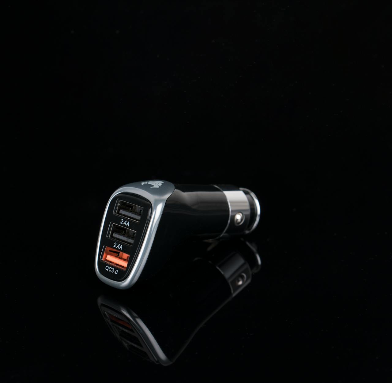 Sleek black car charger featuring multiple USB ports for versatile device charging.